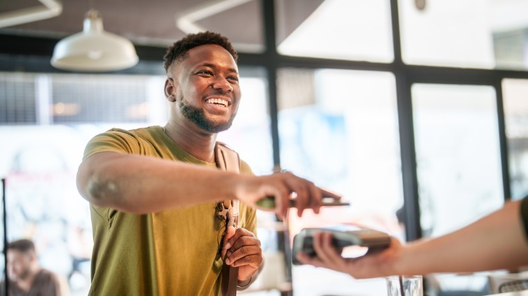 Man making a payment with a credit card.